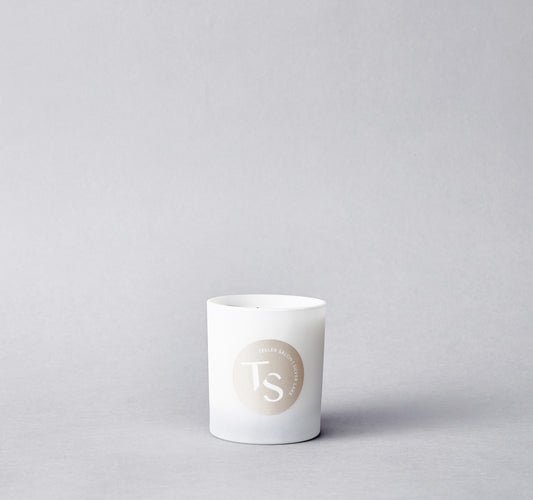 Our crystal-infused candles are handmade in Los Angeles, with soft notes of jasmin and coconut. They come with a unique playlist that embodies the cool Tesler Salon vibe!