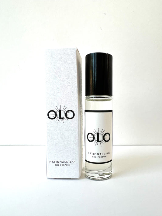 OLO Perfume roller in a glass container next to its white box.